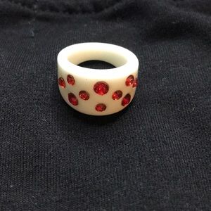 plastic ring with ruby gems